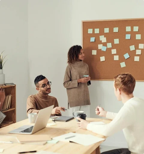 Trust Patrick's Officials group meeting with notes on board.