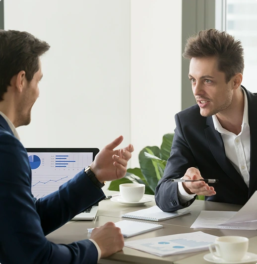 Business meeting with charts and discussion.